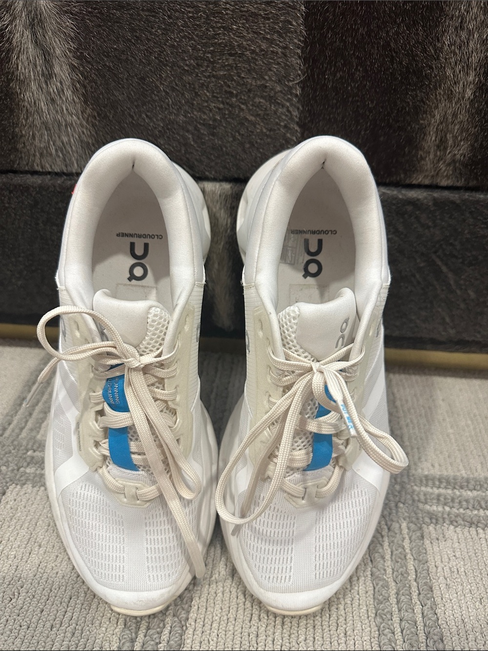 On Cloud Cloudrunner tennis shoes.